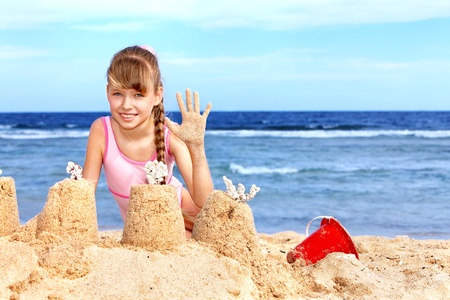 Little girl  playing on  beach.の写真素材