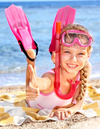 Little girl  playing on  beach.の写真素材
