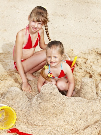 Little girl  playing in sand.の写真素材