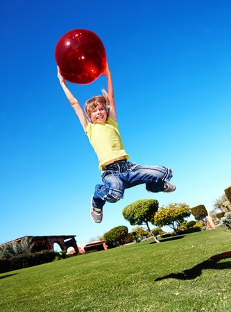 Children playing in park with ball. Outdoor.の写真素材