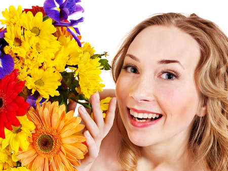 Beautiful  young woman holding  flowers.の写真素材