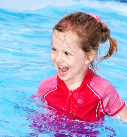 Little girl  swimming in pool.の写真素材