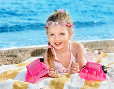 Little girl  playing on  beach.の写真素材