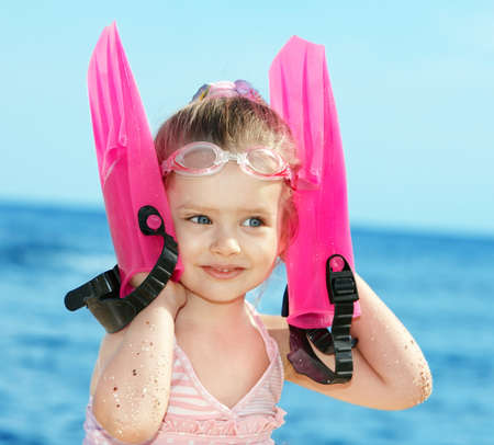 Little girl  playing on  beach.の写真素材