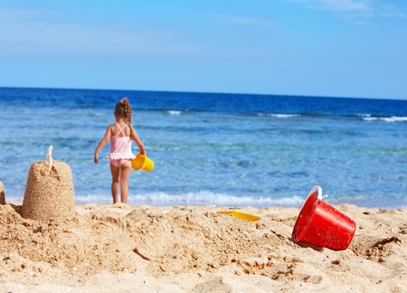 Little girl  playing on  beach.の写真素材