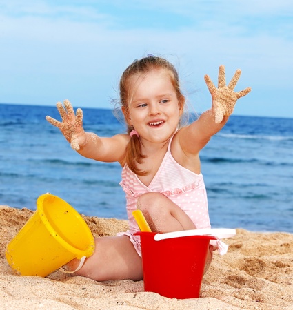 Little girl  playing on  beach.の写真素材