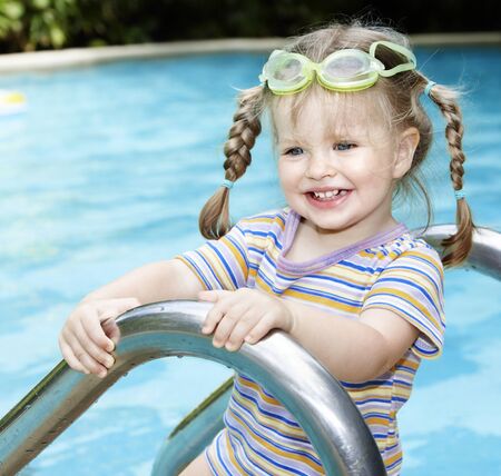 Little girl  swimming in pool.の写真素材