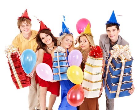 Group of young people in party hat holding gift box and balloon. Isolated.の写真素材