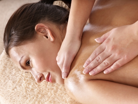 Beautiful young woman having massage.の写真素材