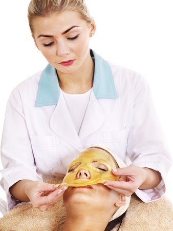 Young womanl with gold facial mask.の写真素材