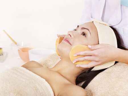 Young woman washing  face by sponge.の写真素材