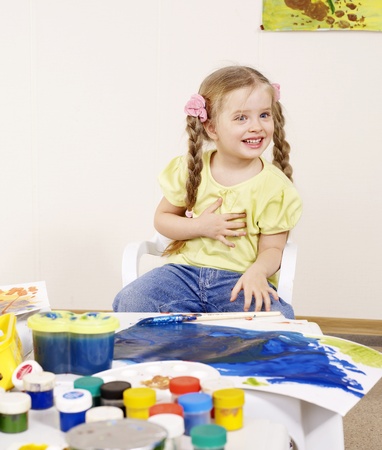 Happy child painting in preschool. の写真素材