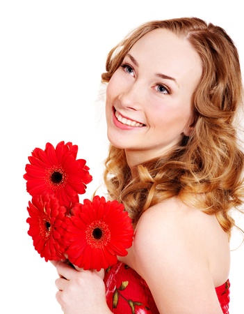 Happy young woman holding red flowers.の写真素材