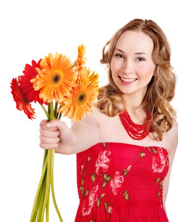 Happy young woman holding red flowers.の写真素材