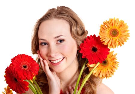 Happy young woman holding red flowers.の写真素材