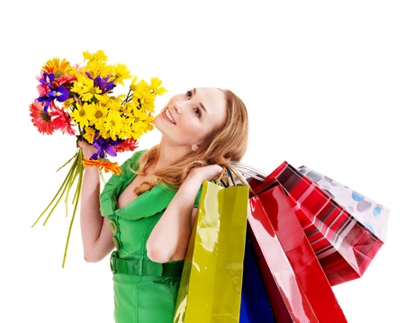 Happy young woman with shopping bag. Isolated.の写真素材