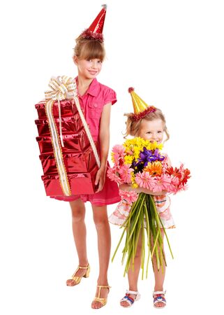 Little girl in party hat with stack gift box. Isolated.の写真素材
