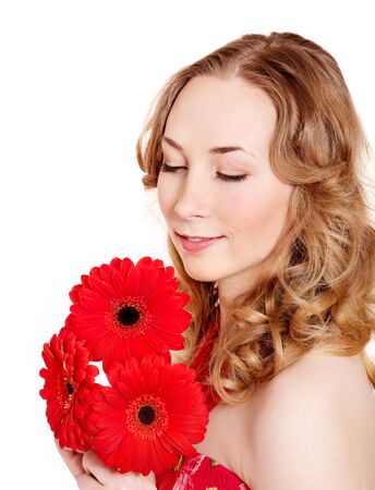 Happy young woman holding red flowers.の写真素材