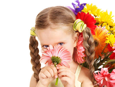 Happy little girl holding bunch of flowers.の写真素材