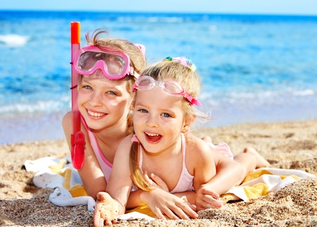 Children playing on  beach. Snorkeling.