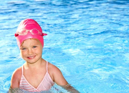 Little girl  swimming in pool.の写真素材