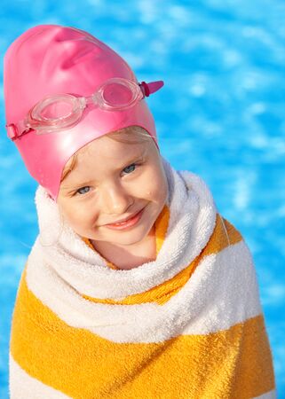 Little girl  swimming in pool.の写真素材