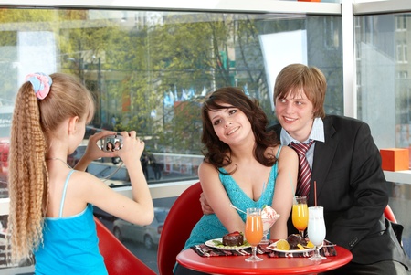 Happy family with child in cafe. Childhood.の写真素材