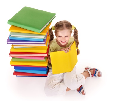 Little girl reading pile of books. Isolated.の写真素材