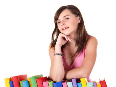 Girl with pile colored book . Isolated.の写真素材