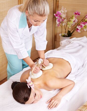 Young beautiful woman on massage table in beauty spa. Series.の写真素材