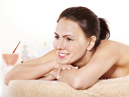 Young beautiful woman on massage table in beauty spa. Series.の写真素材
