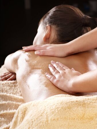 Beautiful young woman having massage.の写真素材