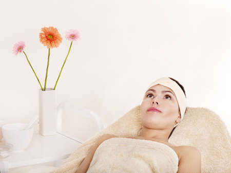 Young beautiful woman on massage table in beauty spa. Series.の写真素材