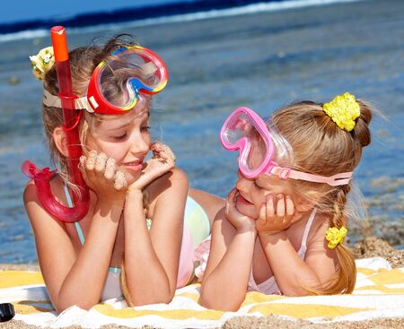 Children playing on  beach. Snorkeling.の写真素材