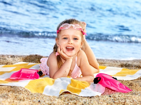 Little girl  playing on  beach.の写真素材