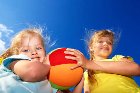 Childrenl playing with ball. Outdoor.の写真素材