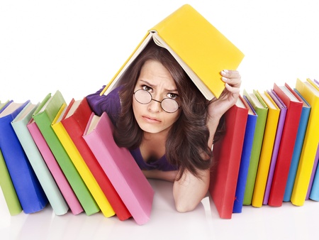 Girl with stack color book . Isolated.の写真素材