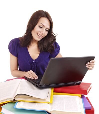 Girl with stack color book  and laptop.. Isolated.の写真素材