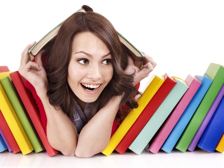 Girl with pile color book . Isolated.の写真素材