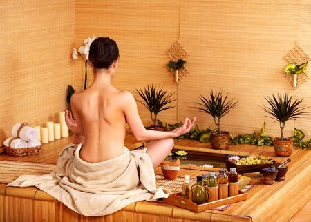 Bamboo massage at spa and woman.の写真素材