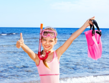 Little girl  playing on  beach.の写真素材