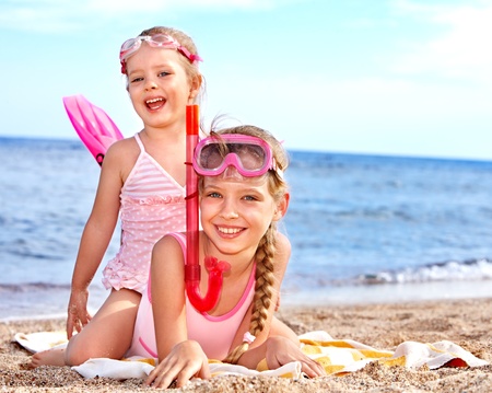 Children playing on  beach. Snorkeling.の写真素材