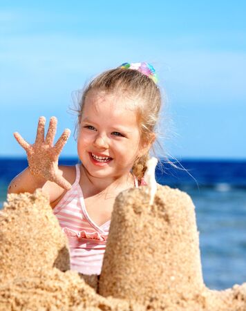 Little girl  playing on  beach.の写真素材