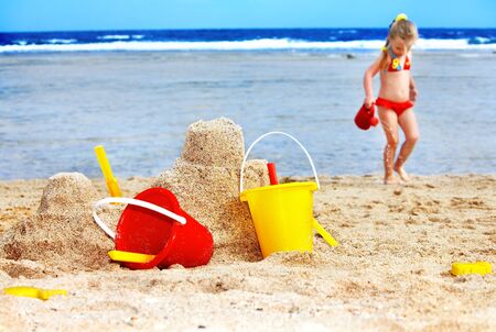 Child  playing on  beach with ball.の写真素材