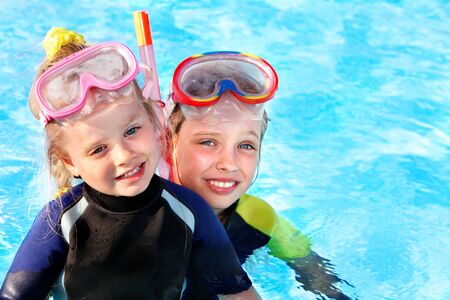 Children in swimming pool learning snorkeling. Sport.の写真素材