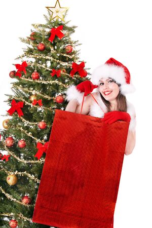 Christmas girl in santa hat giving  gift box.. Isolated.の写真素材