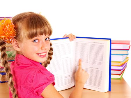 Child reading open  book on table. Isolated.の写真素材