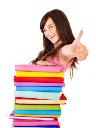 Girl with sttack book showing thumb up. Isolated.の写真素材