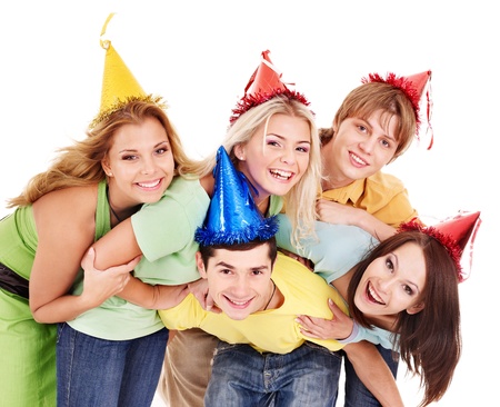 Group of young people in party hat . Isolated.の写真素材
