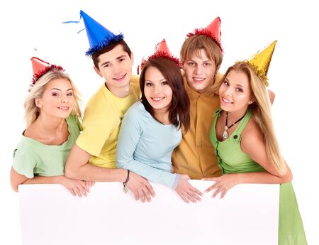 Group of young people in party hat holding banner. Isolated.の写真素材
